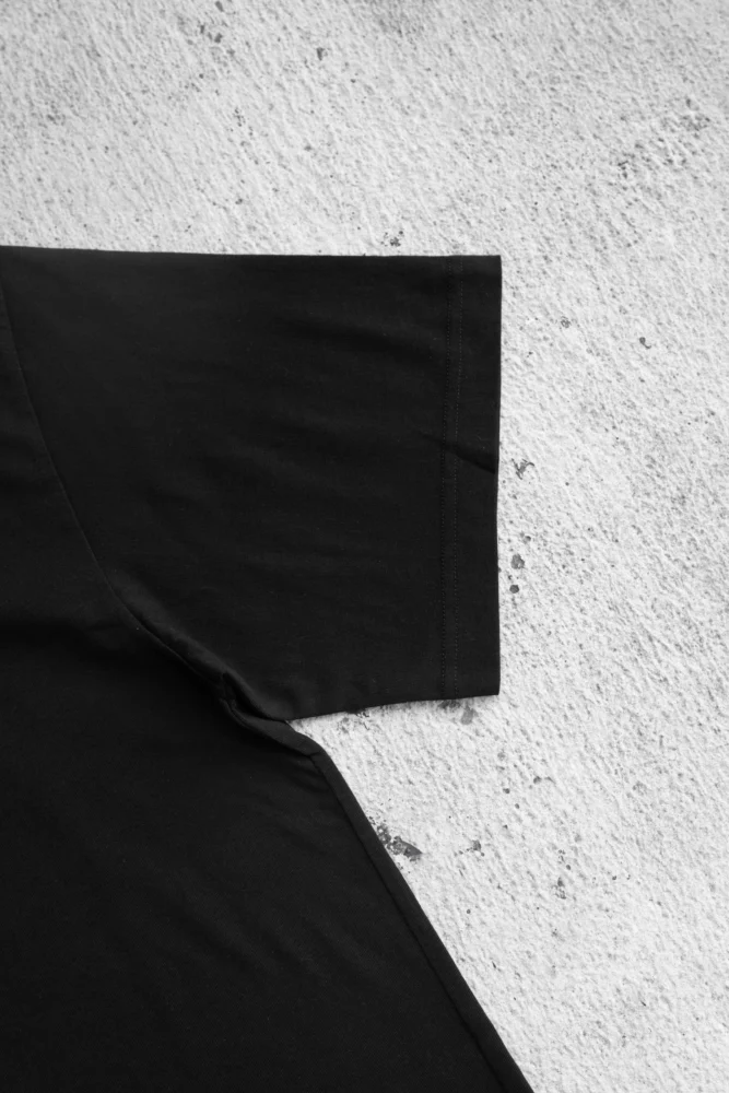 picture of the sleeve for a black t-shirt