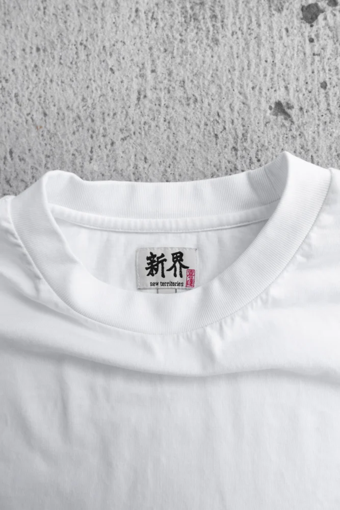 a detail shot of the collar for a white t-shirt